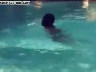 Black and white buddy and tranny poolside fun